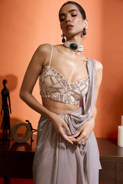Metallic Silver Drape Saree Coupled With A Beaded Blouse