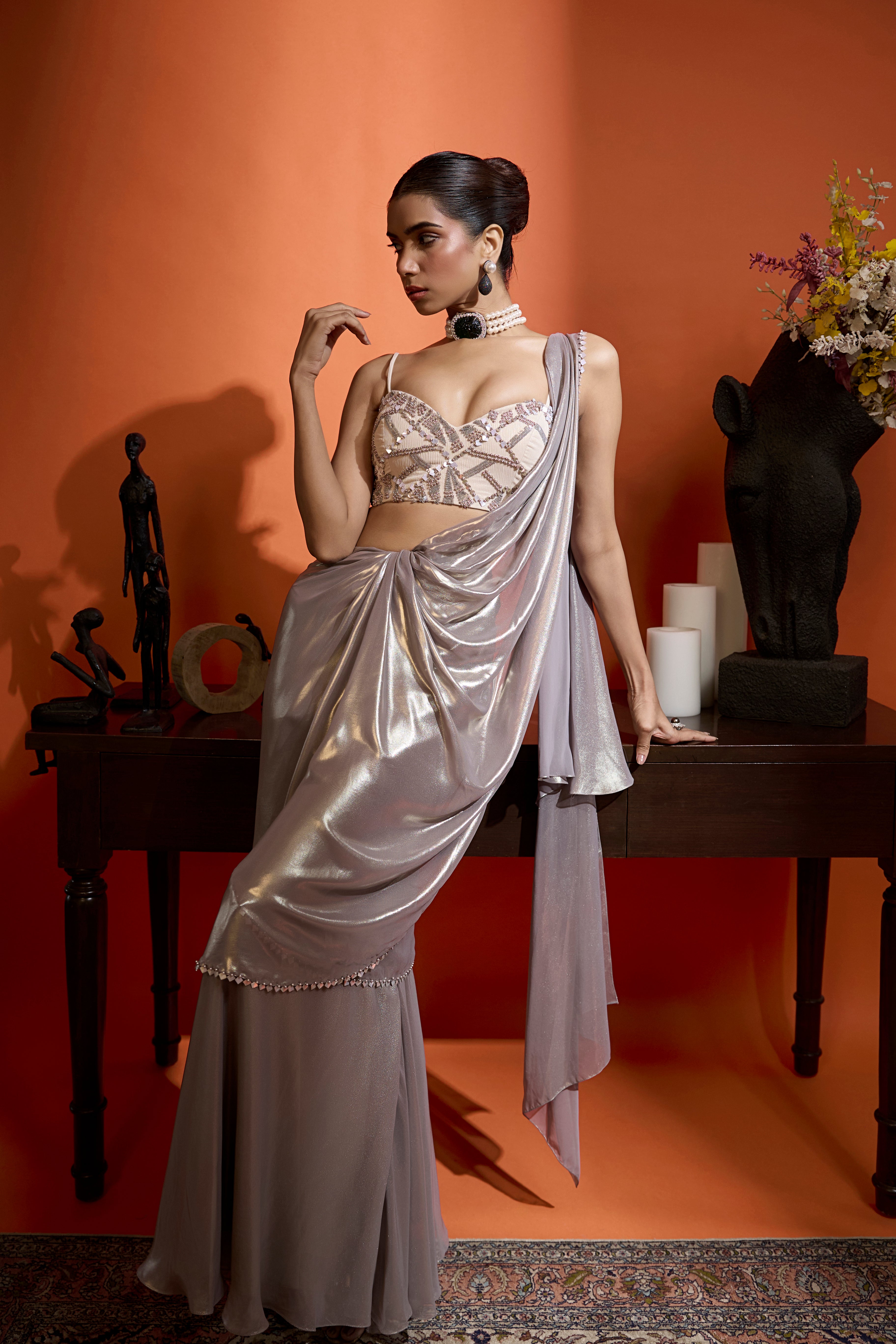 Metallic Silver Drape Saree Coupled With A Beaded Blouse
