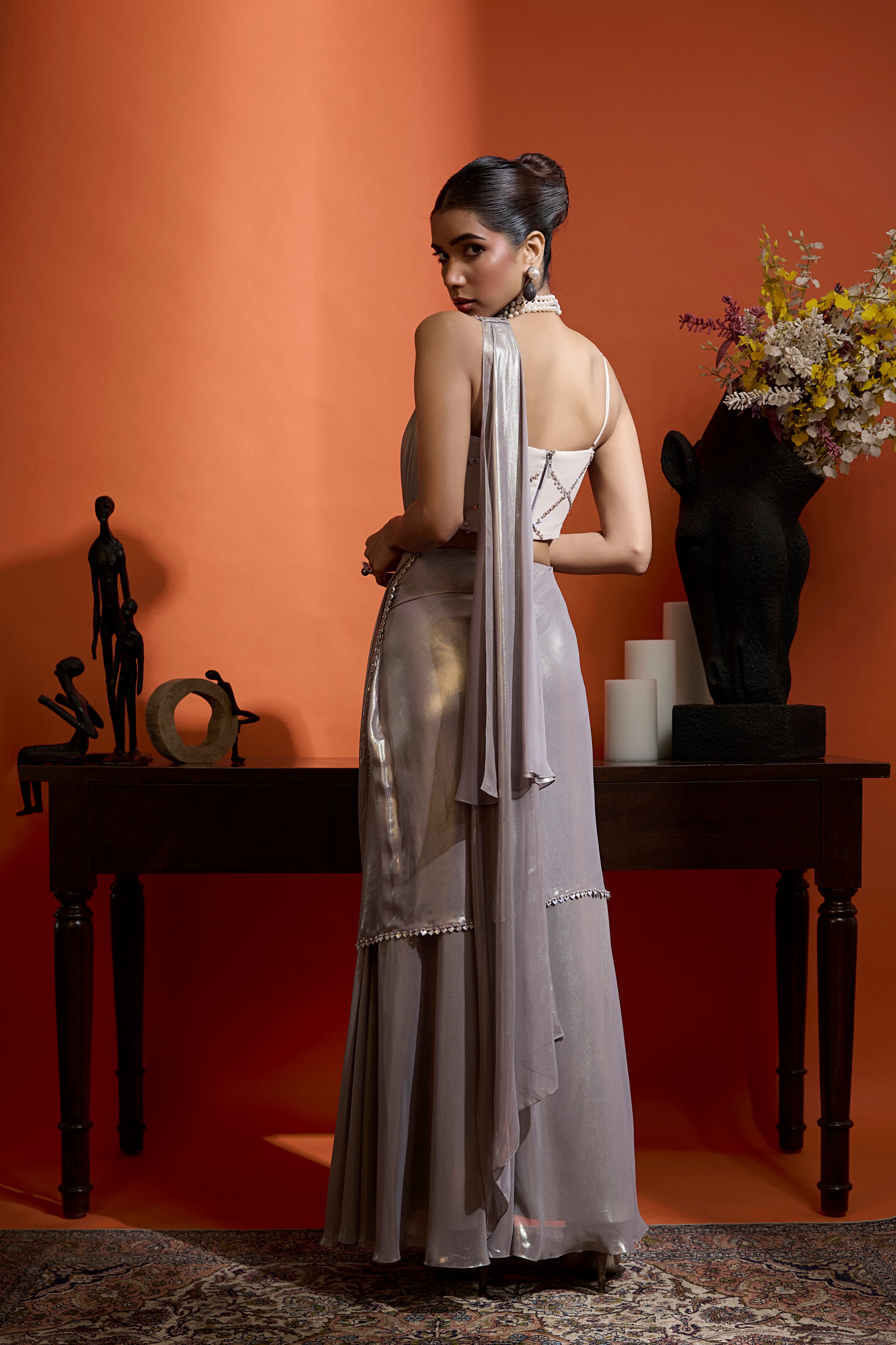 Metallic Silver Drape Saree Coupled With A Beaded Blouse
