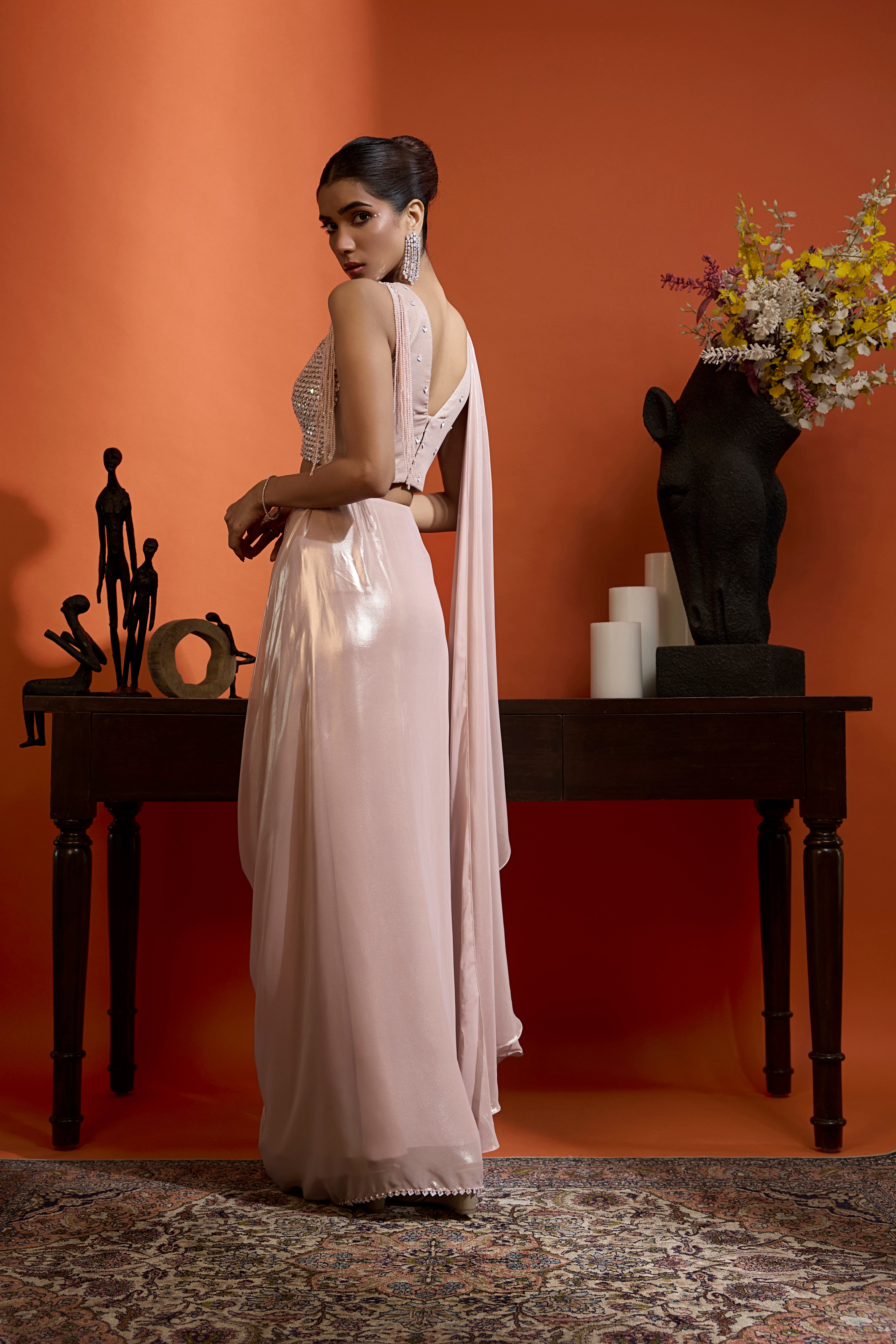 Metallic Blush Drape Saree Coupled With An Embellished Blouse