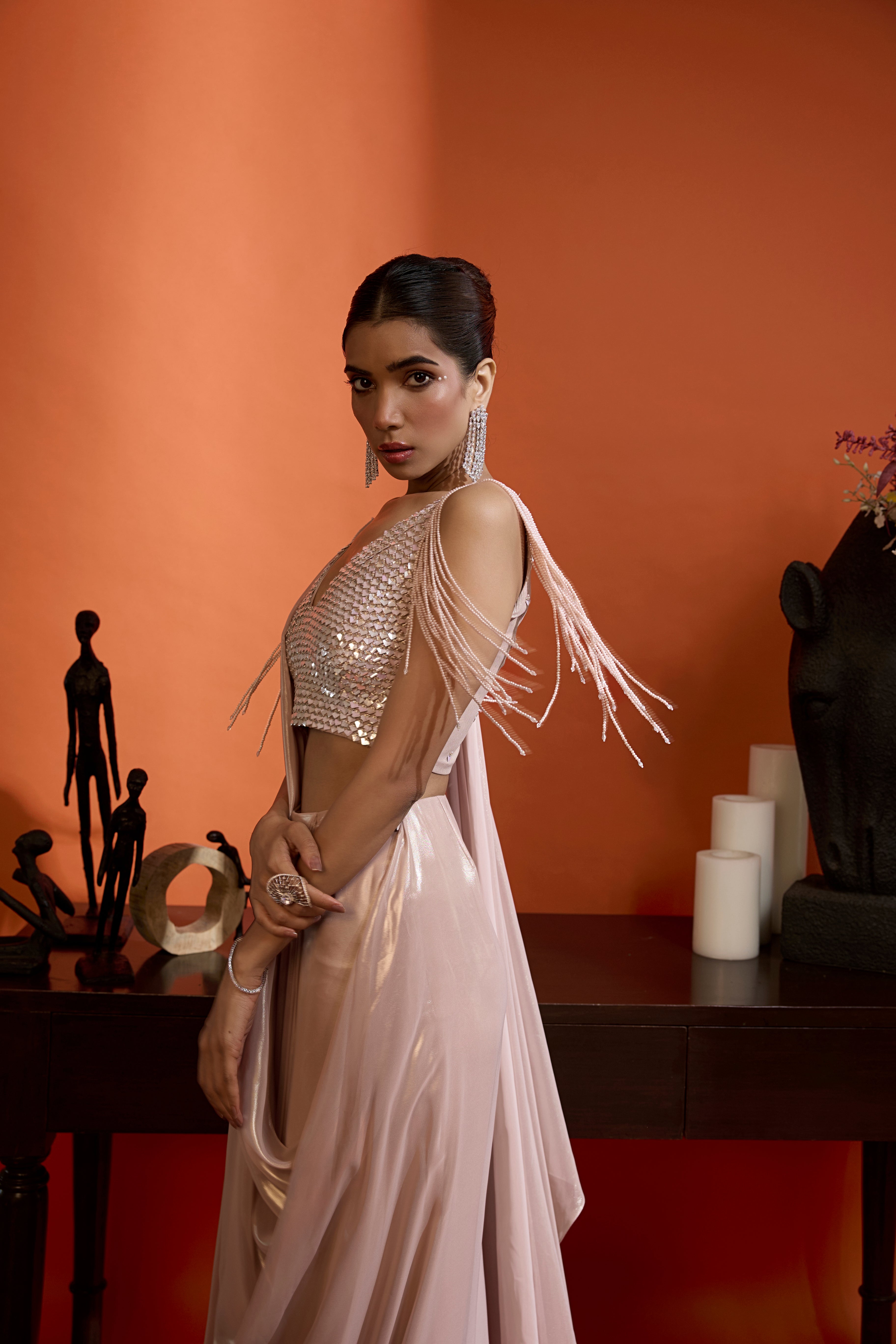Metallic Blush Drape Saree Coupled With An Embellished Blouse