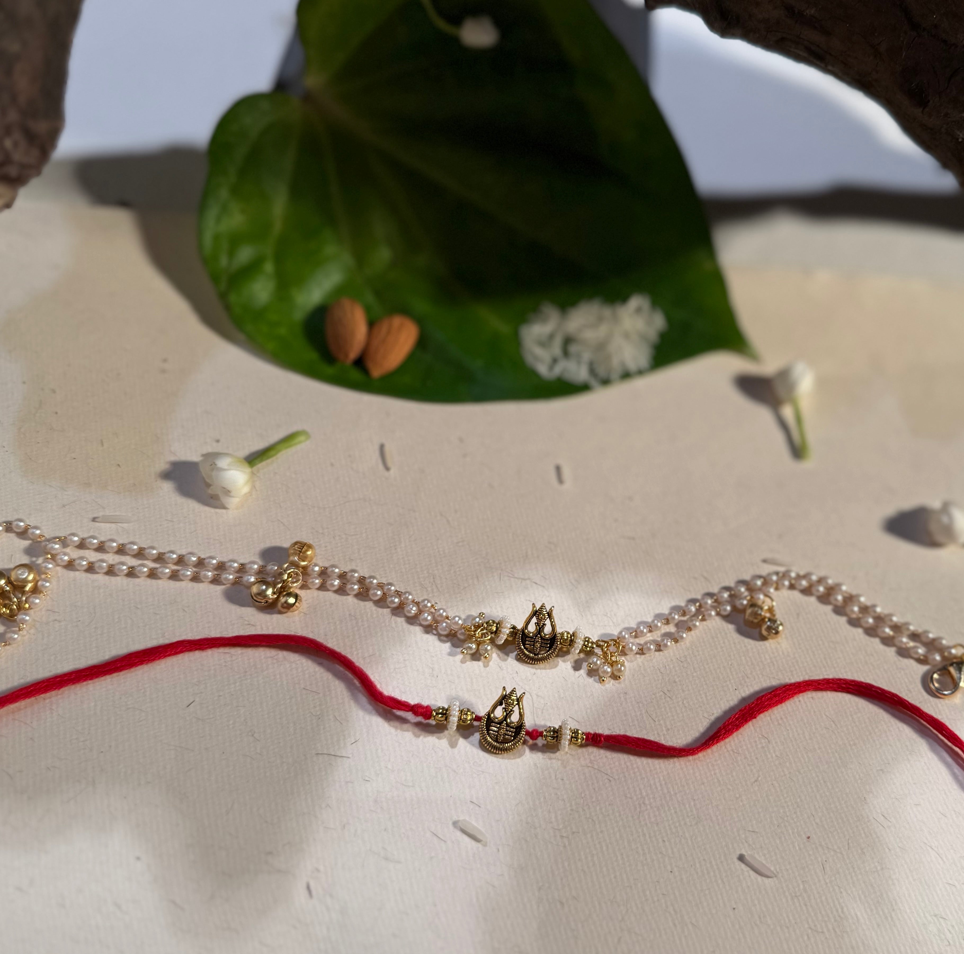 Trinetra Rakhi & Bracelet Set Of Two