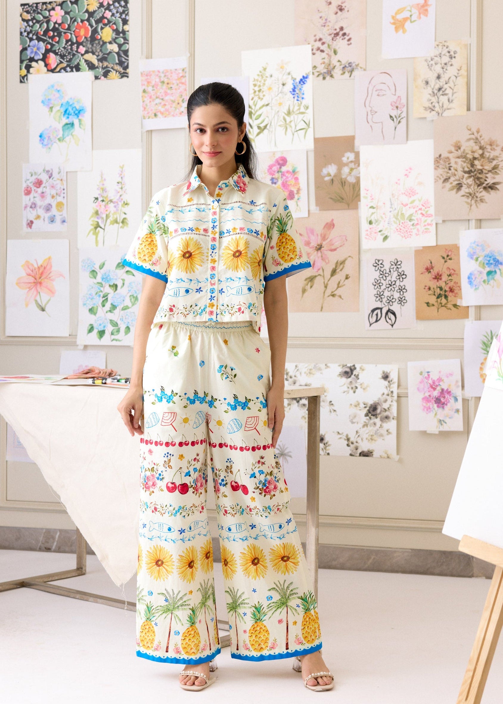 Woman in a colorful outfit standing in front of art displays