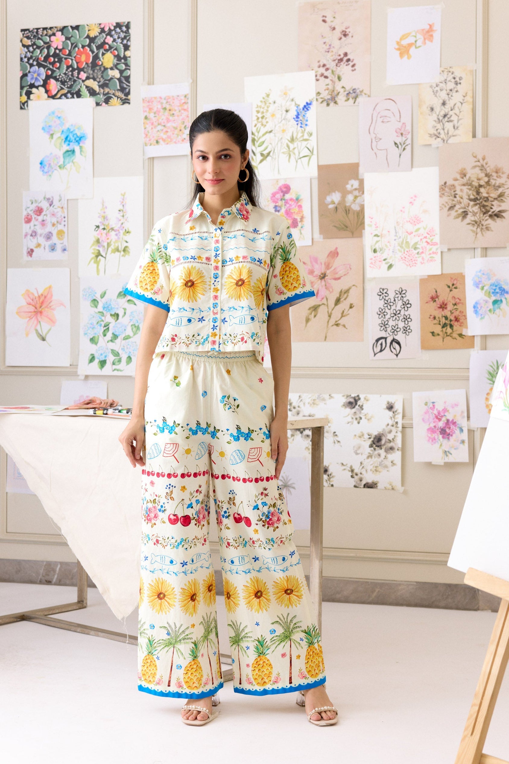 Woman in a colorful outfit standing in front of art displays