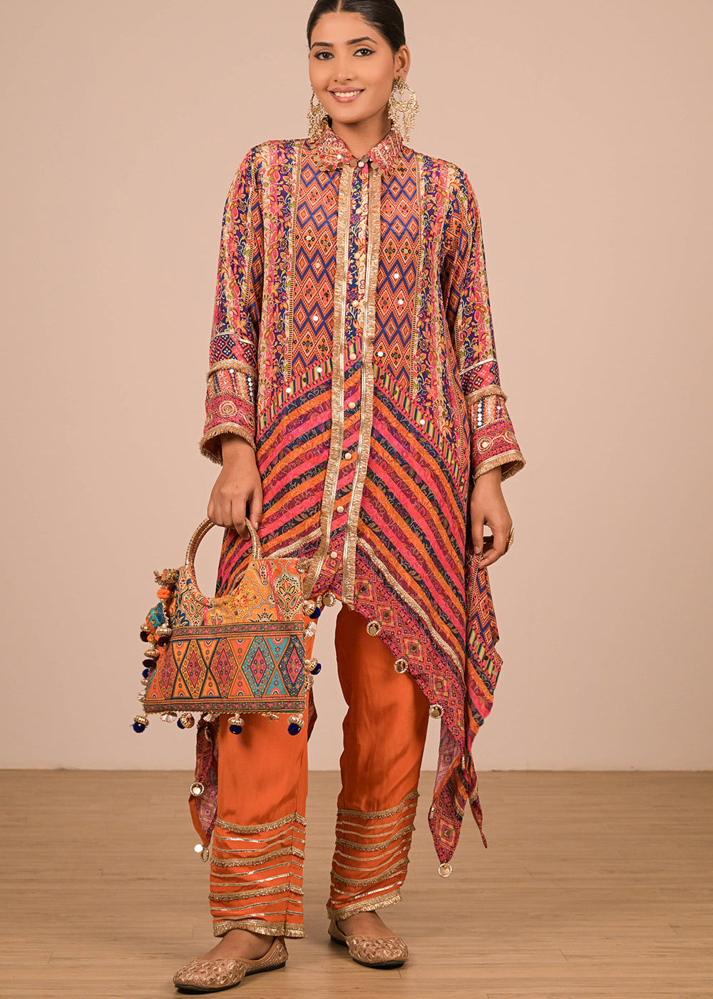 ishum_asymmetrical-orange-kurta-set-in-creope-with-canvas-tote-bag-1.jpg