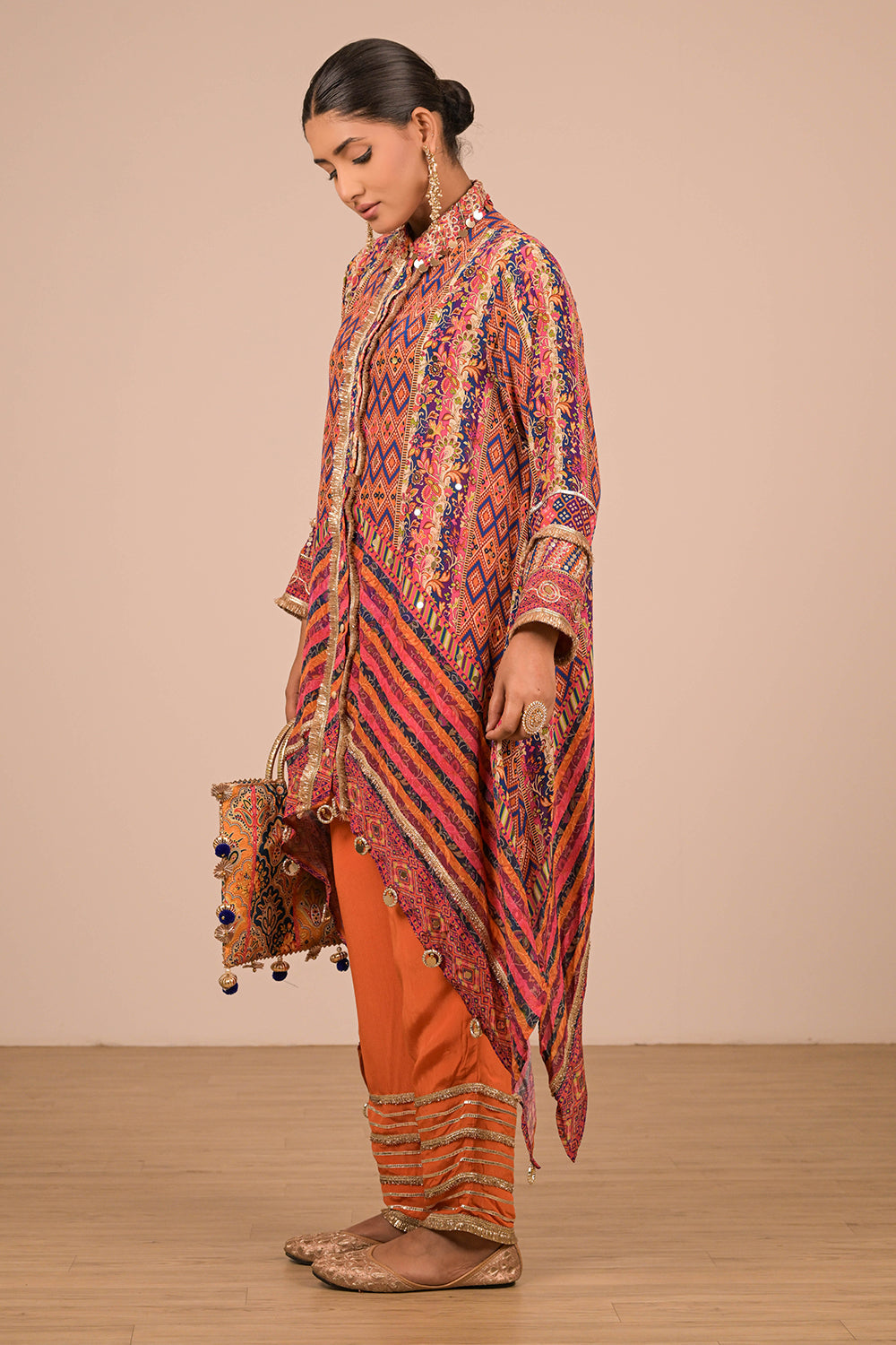 Asymmetrical Orange Kurta Set With Bag