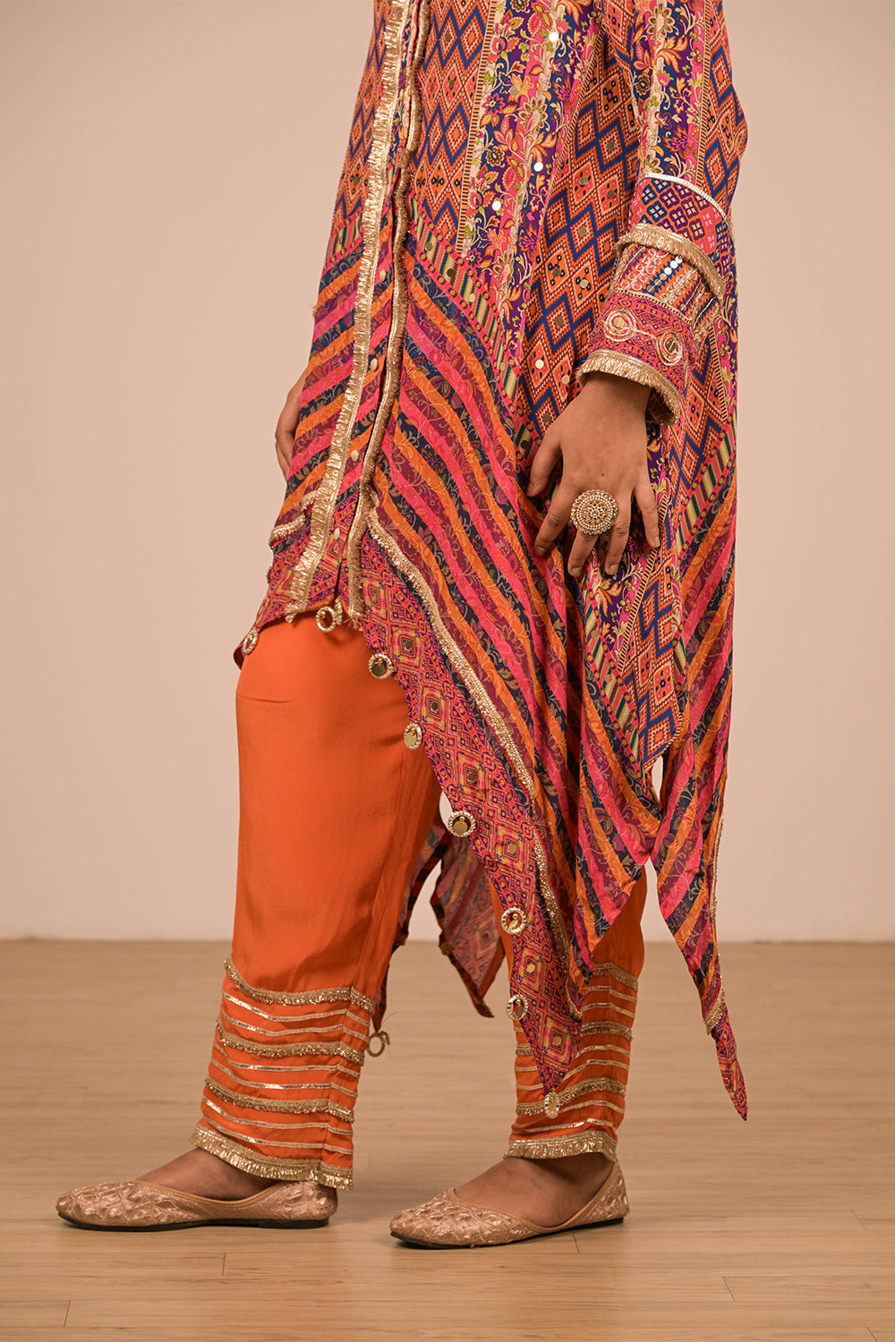 Asymmetrical Orange Kurta Set With Bag