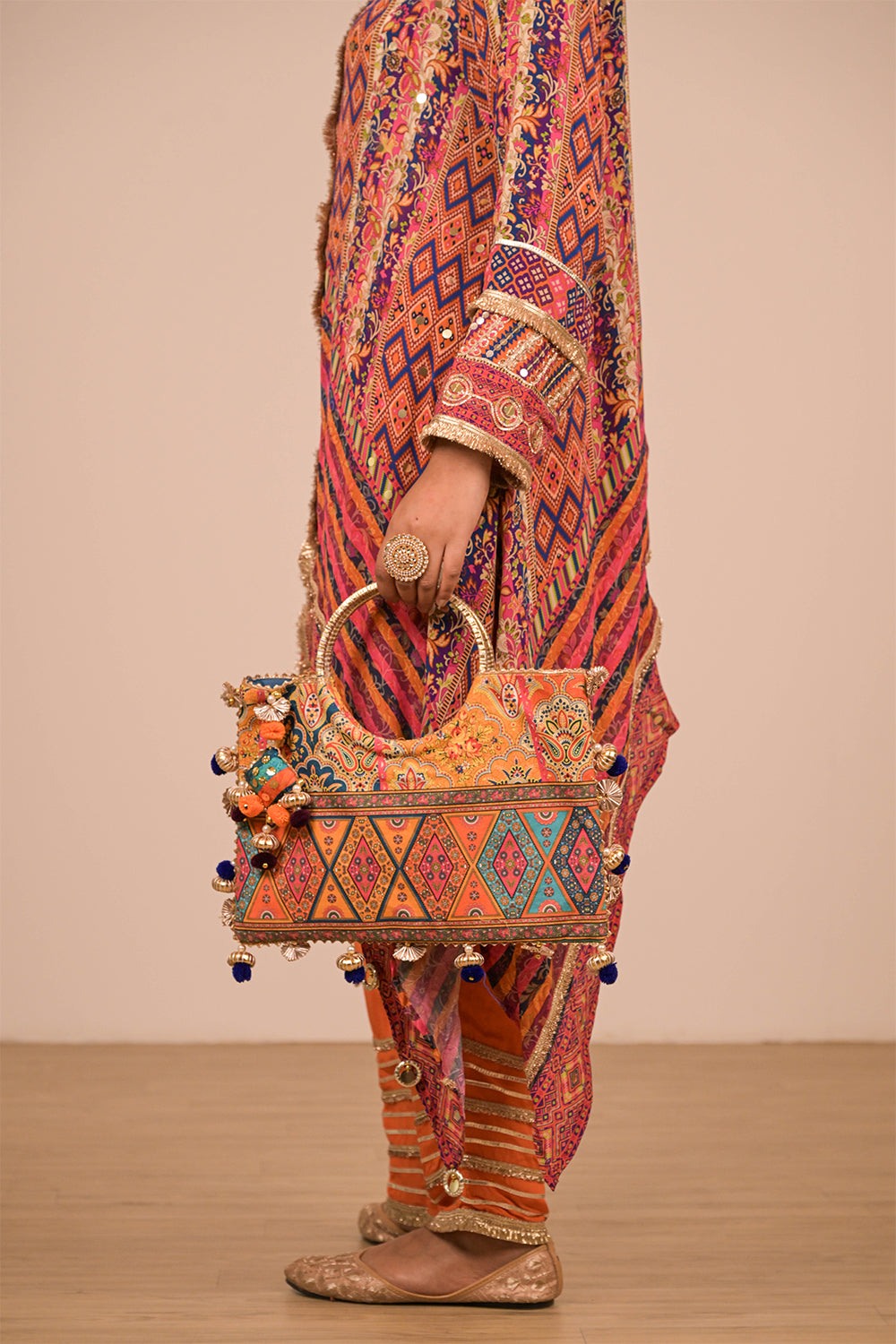 Asymmetrical Orange Kurta Set With Bag