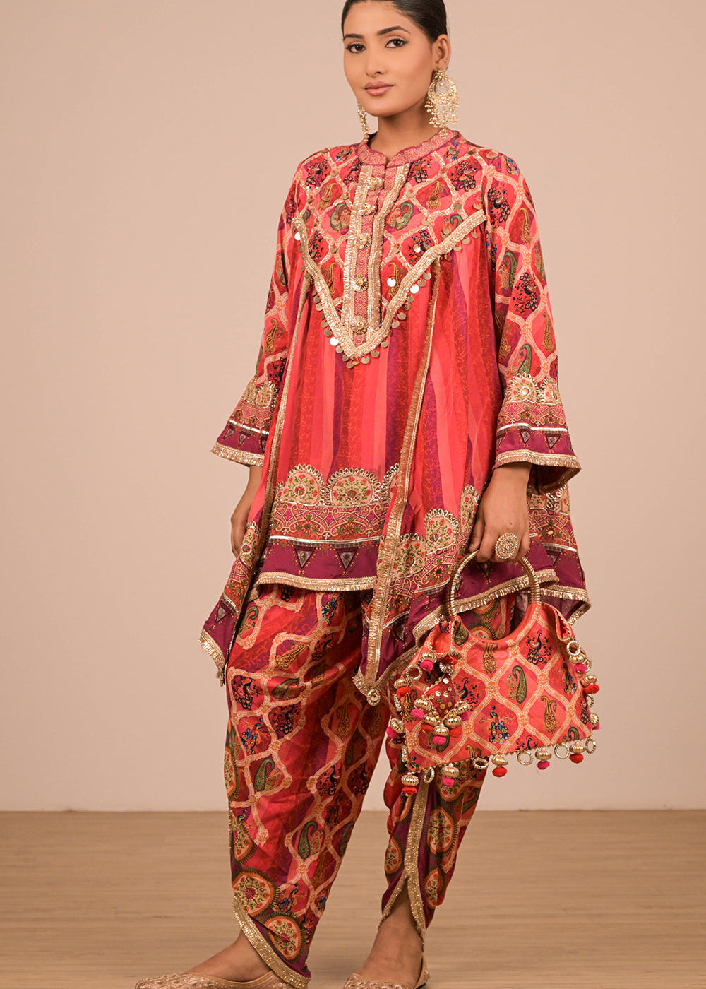 ishum_vibrant-persian-red-crepe-suit-set-with-tulip-pants-and-heavy-embroidered-potli-bag-1.jpg