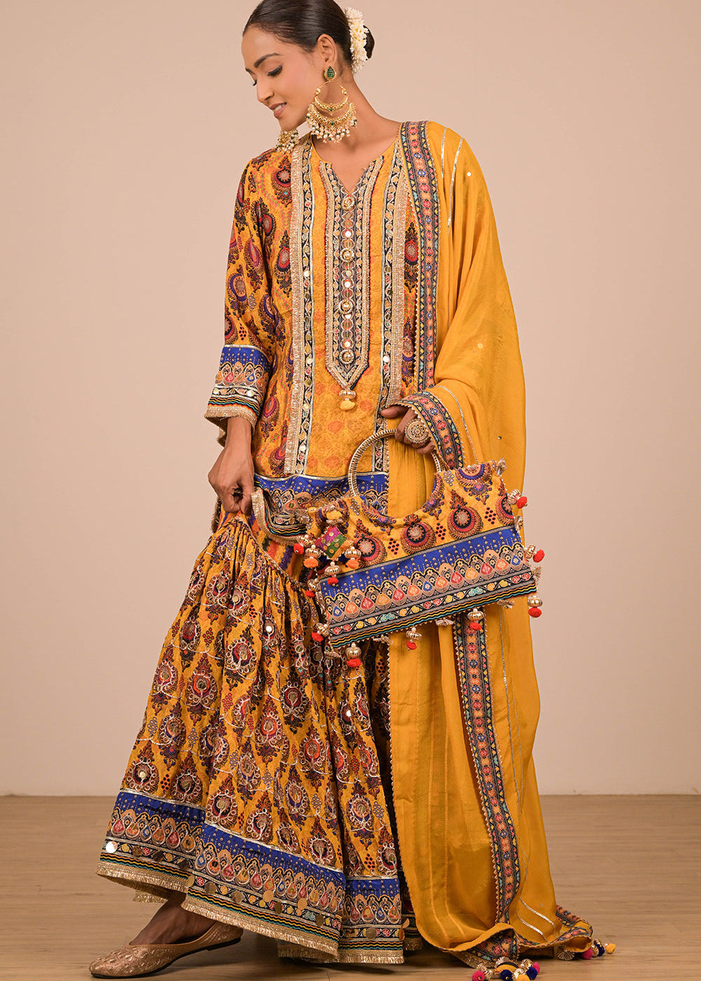 ishum_yellow-crepe-sharara-set-with-canvas-tote-bag-with-vibrant-print-motifs-1.jpg